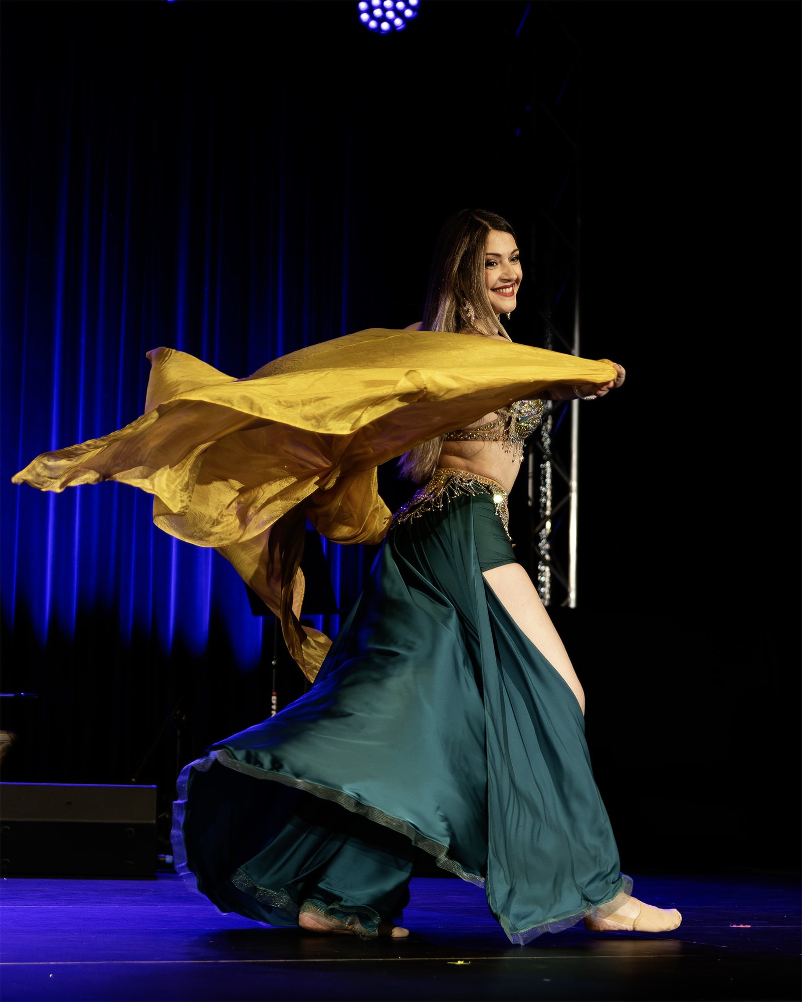 Belly dance Edinburgh teacher in a teal costume