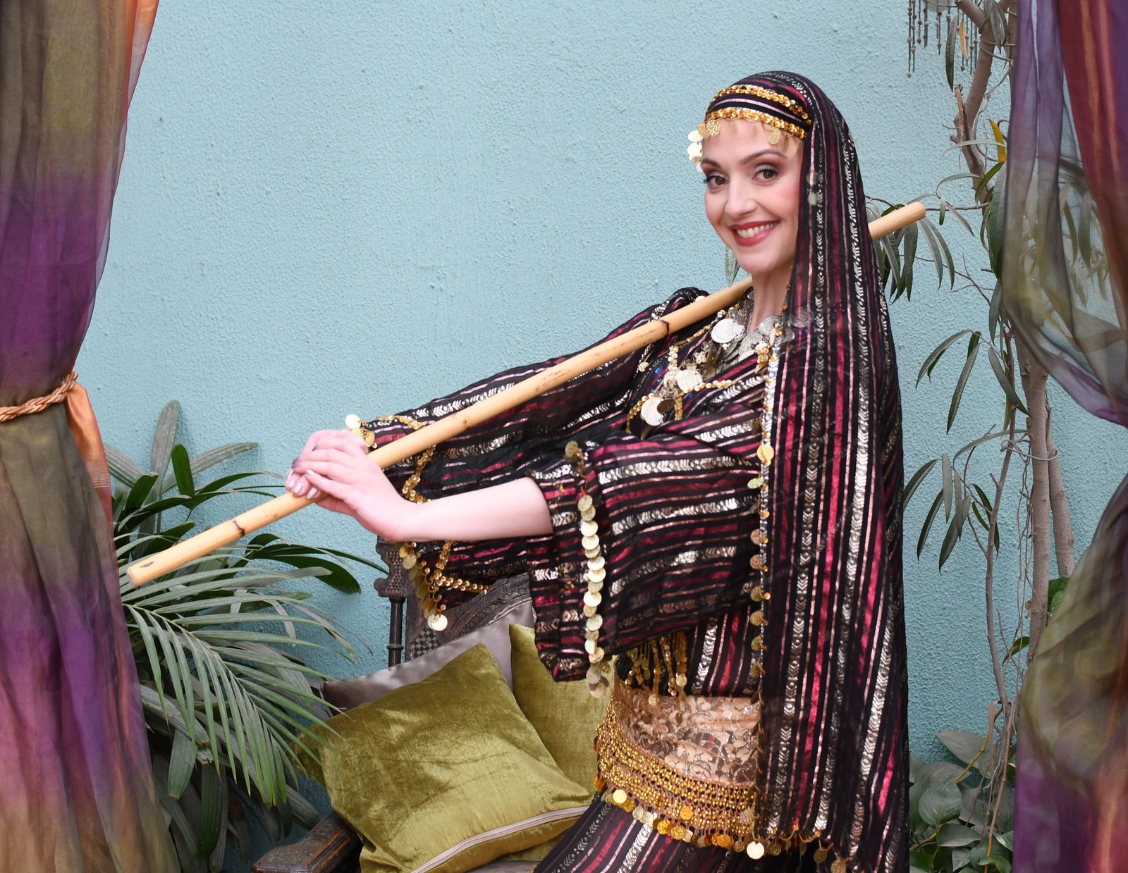 Belly dance Edinburgh teacher holding a cane for saidi dance
